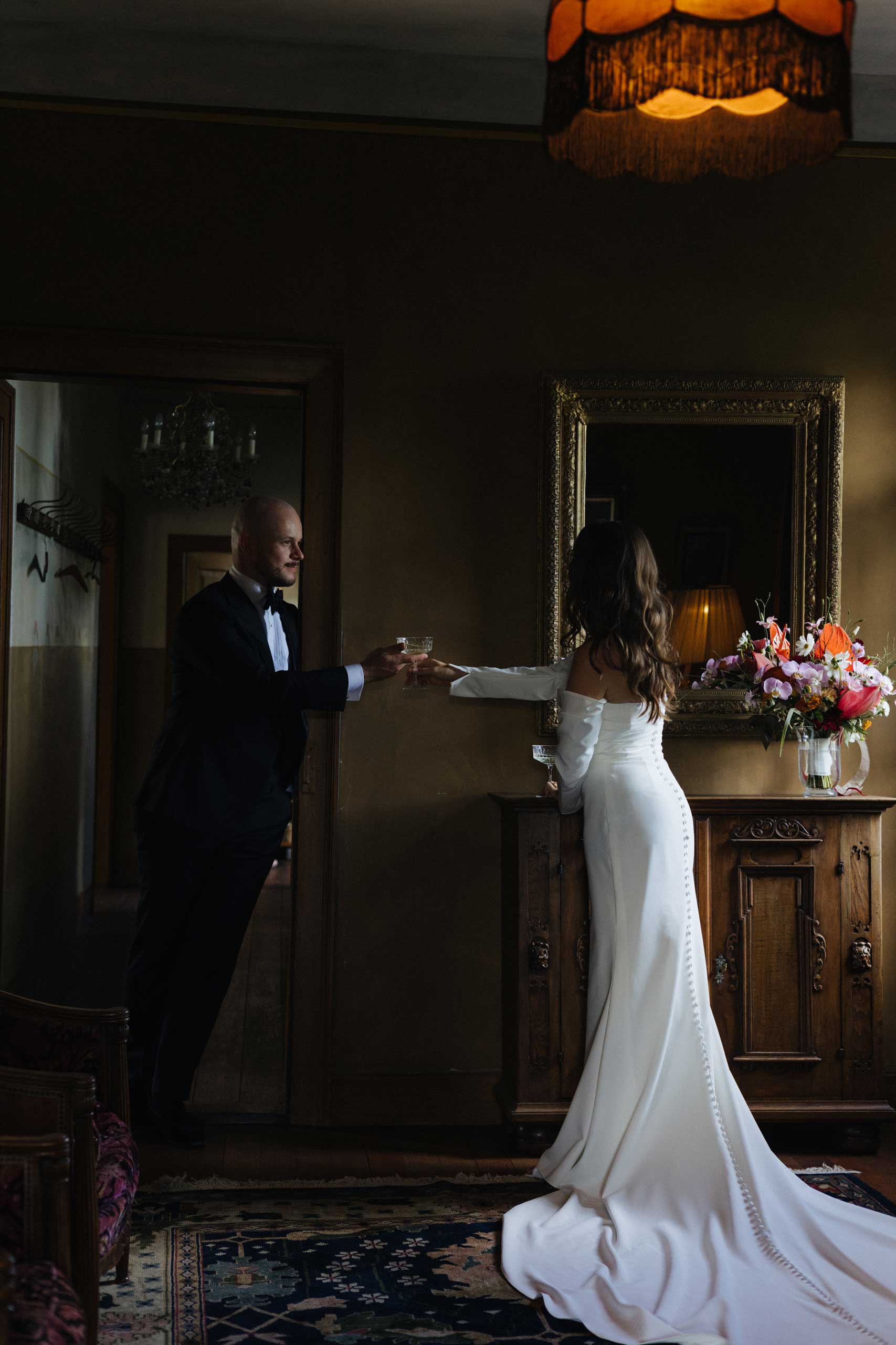 luzyka-stuttgart-wedding Couple dancing joyfully in the street, dressed in modern white outfits with pink heels and sneakers.<br />